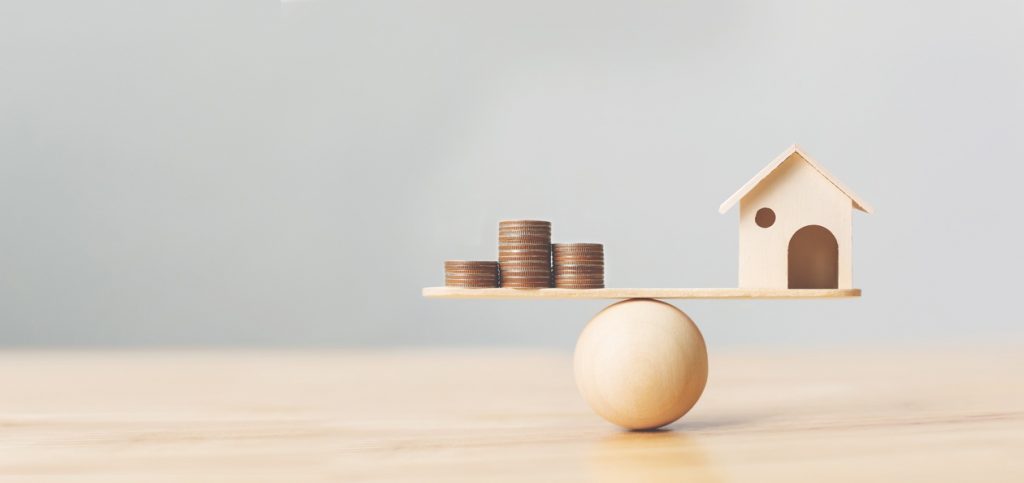 House And Money On a Stick Balance Scale