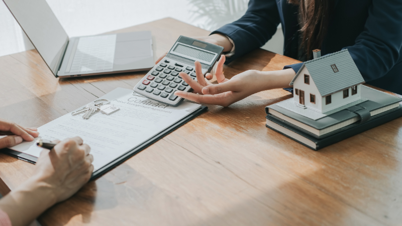 woman holding calculator